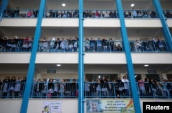 Palestinian schoolchildren watch a news conference by UNRWA Commissioner-General Pierre Krahenbuhl at a U.N.-run school in Gaza City, Jan. 22, 2018.