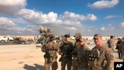 U.S. Soldiers stand at a site of Iranian bombing at Ain al-Asad air base in Anbar, Iraq, Jan. 13, 2020. 