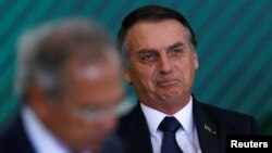 FILE - Brazil's President Jair Bolsonaro attends a ceremony at the Planalto Palace in Brasilia, Brazil, Jan. 7, 2019.