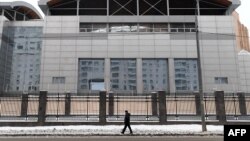 FILE - A man walks past the building of the headquarters of the Russian General Staff's Main Intelligence Department (GRU) in Moscow, Dec. 30, 2016. (AFP PHOTO / Natalia KOLESNIKOVA)