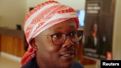 FILE - Former Prime Minister and presidential candidate Umaro Cissoko Embalo chats with his supporters and members of his campaign team, after the results of the first-round poll, at a hotel lobby in Bissau, Guinea-Bissau, Nov. 27, 2019. 