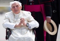 FILE - Emeritus Pope Benedict XVI arrives for his departure at Munich Airport in Freising, Germany, June 22, 2020.