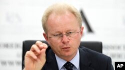 FILE - Mark Schipp, the President of World Organization for Animal Health briefs media in Sydney, Oct. 31, 2019, on the threat of African swine fever.