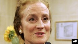 FILE - Henrietta Holsman Fore, then-US administrator of the Agency for International Development (USAID), answers a reporter during an interview in Paris, June 11, 2008.