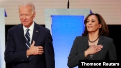 Former Vice President Biden and Senator Harris take the stage in Detroit, Aug. 11, 2020.