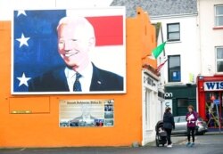 A mural of U.S. presidential candidate Joe Biden is seen on a gable wall in Ballina, west of Ireland, Nov. 4, 2020. Ballina is the ancestral home of Biden.