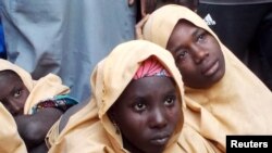FILE - Some of the newly-released Dapchi schoolgirls are pictured in Jumbam village, Yobe State, Nigeria March 21, 2018. 