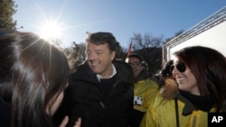 Former Italian Premier Matteo Renzi attends a demonstration staged by the Democratic party, in Como, Italy, Saturday, Dec. 9, 2017.