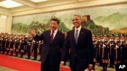 中国国家主席习近平2014年11月12日与举行仪式迎接美国总统奥巴马到访北京