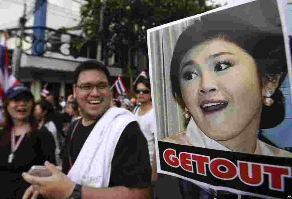 A poster of Thai Prime Minister Yingluck Shinawatra is displayed during a rally against an amnesty bill in Bangkok, Nov. 11, 2013.&nbsp;