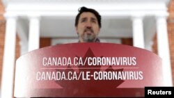 Perdana Menteri Kanada Justin Trudeau menghadiri konferensi pers sebagai upaya terus membantu memperlambat penyebaran Covid-19 di Ottawa, Ontario, Kanada, 23 Maret 2020. (Foto: REUTERS/Blair Gable)