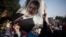 An Egyptian woman holds a portrait of ousted Egyptian President Mohamed Morsi during a protest in Nasr City in Cairo, Nov. 1, 2013.