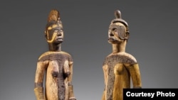 The auction of two wooden Igbo figures from Nigeria on June 29, 2020, has prompted new calls for repatriation of African artifacts. (Courtesy Christie’s)