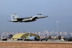FILE - A U.S. Air Force F-15 fighter jet takes off from Incirlik Air Base, near Adana, Turkey, Dec. 15, 2015.