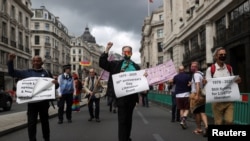 Veteran British LGBT+ rights campaigner Peter Tatchell takes part in the Gay Liberation Front pride march in London, June 27, 2020. 