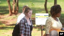U.S. Citizen Martha O' Donovan, center, appears at the Harare Magistrates court in Harare, Saturday, November, 4, 2017.