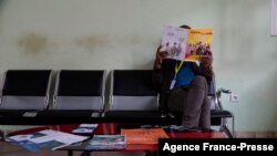 FILE - A homosexual man waits to get his antiretrovirals in a health center dedicated to the LGTBI community in Yaounde, Cameroon, Oct. 7, 2019.