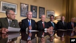 From left, Senate Judiciary Committee Chairman Chuck Grassley, R-Iowa, Senate Majority Leader Mitch McConnell, R-Ky., Senate Finance Committee Chairman Orrin Hatch, R-Utah, Treasury Secretary Steven Mnuchin, President Donald Trump's top economic adviser Gary Cohn, and Sen. Rob Portman, R-Ohio, talk to reporters as work gets under way on the Senate's version of the GOP tax reform bill, on Capitol Hill in Washington, Nov. 9, 2017. 