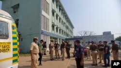 Police officers investigate the scene after a fire broke out at District General Hospital in Bhandara, about 70 kilometers from Nagpur, India, Jan. 9, 2021. 