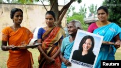 Women gather to celebrate the victory of Kamala Harris in Painganadu near the village of Thulasendrapuram, where Harris' maternal grandfather was born and grew up, in the southern state of Tamil Nadu, India, Nov. 8, 2020.