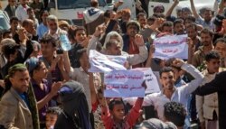 Opponents of Yemen's Houthi rebels rally in support of the United States and the former Trump administration's decision to apply the "terrorist" designation to the Iran-backed movement, in Yemen's third city of Taez, Jan. 27, 2021.