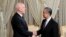 Tunisian President Kais Saied, left, shakes hands with Chinese Foreign Minister Wang Yi on Jan. 15, 2024, in Tunis. (Tunisian Presidency via AP)