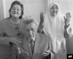 The Jewish family that lived with the Kazazi family (pictured) escaped the Nazis during searches by scrambling through connecting doorways to other homes. "Our parents were not very religious, but they believed in the Koran and Besa," the grown Kazazi chi