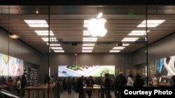 Customers check new Apple smartphones and Apple watches at a store in Woodbridge, Virginia. (Photo: Diaa Bekheet)