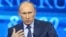 Russian President Vladimir Putin takes questions as part of a live broadcast in Moscow, April 25, 2013. 