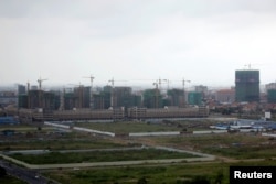 FILE - A construction site from the Boeung Kak Lake project in Phnom Penh, Cambodia, May 26, 2017.