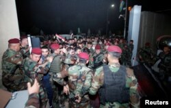 Demonstrators try to pass through a police blockade at the Kurdistan Parliament building in Irbil, Iraq, Oct. 29, 2017.