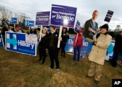 Supporters for Hillary Clinton, Bernie Sanders and Martin O’Malley rally outside the debate hall before the Dec. 19 Democratic presidential debate at Saint Anselm College in Manchester, N.H.
