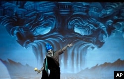 Contestant Jose Davalos performs as "Hades from Hercules" during the 41st Annual Comic-Con Masquerade costume competition in San Diego, California, July 11, 2015.