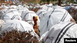 FILE - An Ethiopian girl carries water at the Somare refugee camp on the Ethiopian-Kenyan border near the town of Moyale, Kenya March 27, 2018. Picture taken March 27, 2018.