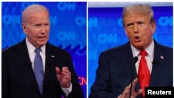 លោកប្រធានាធិបតី​ Joe Biden(ឆ្វេង) និង​បេក្ខជន​ប្រធានាធិបតី​នៃបក្ស​សាធារណរដ្ឋ​លោក Donald Trump​ (ស្តាំ) ឈរ​អំឡុង​ពេលសម្រាកក្នុង​ការ​ជជែក​ដេញដោល​គ្នាមួយ​ដែល​រៀបចំ​ដោយ CNN កាលពីថ្ងៃព្រហស្បត្តិ៍​ទី​២៧ មិថុនា ឆ្នាំ២០២៤ ក្នុង​ទីក្រុង Atlanta។