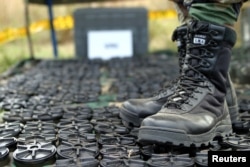 FILE - Hundreds of mines were disabled by the Colombian army in Buga, Valle del Cauca province, as part of the 1997 mine ban treaty signed in Canada, Aug. 31, 2004.