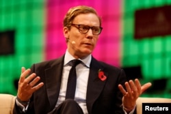 FILE - CEO of Cambridge Analytica, Alexander Nix, speaks during a tech conference, in Lisbon, Portugal, Nov. 9, 2017.
