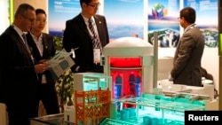 FILE - A nuclear power plant station model by China National Nuclear Corporation is pictured at the World Nuclear Exhibition 2014, the trade fair event for the global nuclear energy sector, in Le Bourget, near Paris, October 14, 2014. 