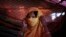 FILE - S, 22, mother of one, who says she was raped by members of Myanmar's armed forces in late August, is photographed in her tent in Gundum refugee camp in Bangladesh, Nov. 23, 2017. 