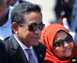 FILE - Maldives President Yameen Abdul Gayoom, accompanied by his wife Fathimath Ibrahim, arrives in Colombo, Sri Lanka, July 22, 2015.
