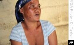 Sanna Winston's head and face bear the bruises and bumps of a previous assault; her arms are also covered in knife-scars.