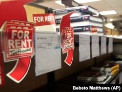 In this October 22, 2010 photo, student textbooks for rent sit on the shelves at the City College Bookstore in New York.