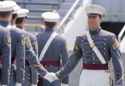 FILE - Mike Pompeo, top graduate of the 1986 class at the U.S. Military Academy at West Point, New York, is congratulated by fellow cadets during graduation ceremonies, May 29, 1986.