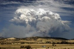 Smoke from wildfires is seen east of Hobart in the Australian island state of Tasmania Jan. 4, 2013.