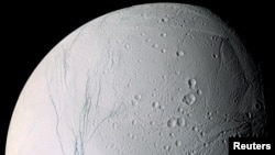 A mosaic image of Saturn's moon Enceladus shows the long fissures in the moon's icy crust at its south pole that allows water from the subsurface ocean to spew into space. (NASA/JPL/Space Science Institute/Handout via REUTERS)
