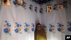 FILE - Child bride Sarey Amadou, 14, in her bedroom in Hawkantaki, Niger in 2012.
