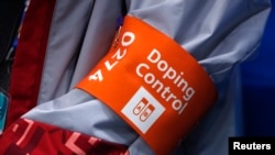 FILE - A doping control official attends the women's semifinal ice hockey game played between Canada and Russia on Feb. 19, 2018, at the 2018 Winter Olympics in Gangneung, South Korea.