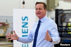 Britain's Prime Minister David Cameron speaks to factory staff at the Siemens plant in Chippenham, southern England, Feb. 2, 2016.