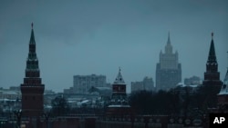 FILE - The Russian Foreign Ministry building, center-right in the background, is seen from outside the Kremlin, in Moscow, Russia, Dec. 10, 2018.