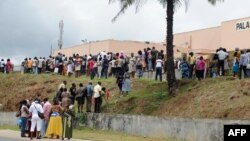 Relatives gather outside the Palais de Justice (law courts) in Libreville on Sept. 5, 2016, waiting for news of their relatives who were arrested following post-election chaos in which three killed and 105 wounded.